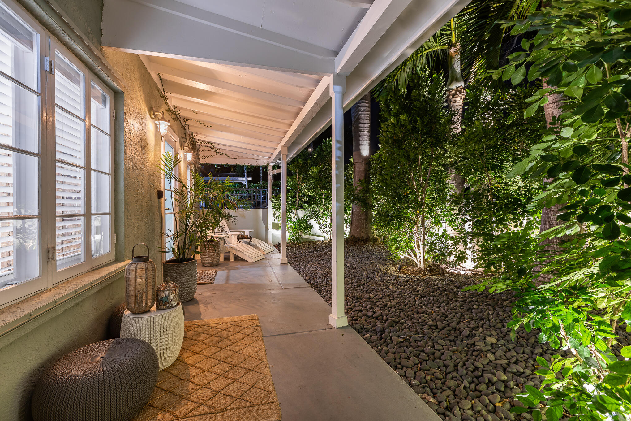 916 Seminary Street Key West, FL 33040 - Photo 5 of 37 a view of a porch with chairs and floor to ceiling window