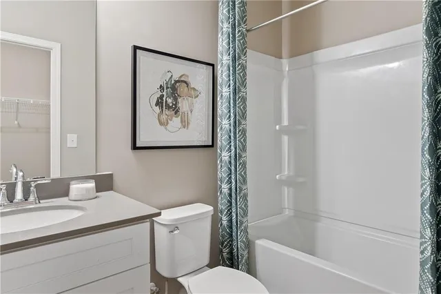 a bathroom with a toilet a sink and bathtub