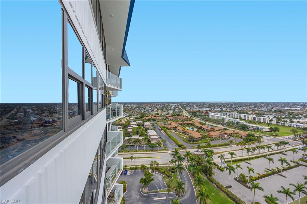 58 North Collier Boulevard, Unit 2101 Marco Island, FL 34145 - Photo 21 of 30 an aerial view of a residential apartment building with a yard