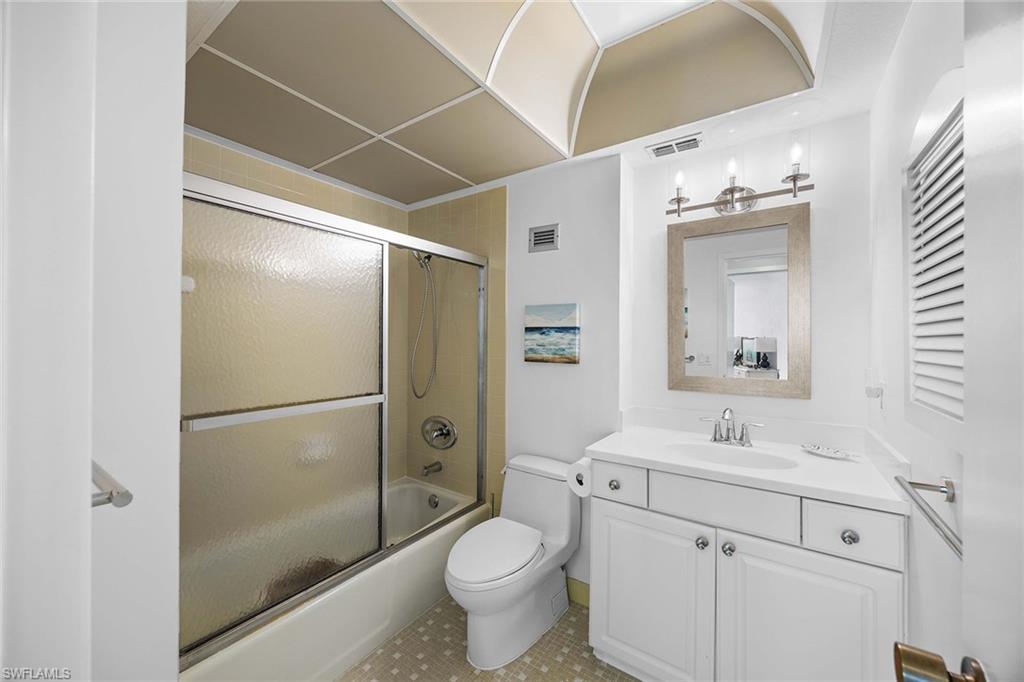 58 North Collier Boulevard, Unit 2101 Marco Island, FL 34145 - Photo 25 of 30 a bathroom with a sink toilet and shower