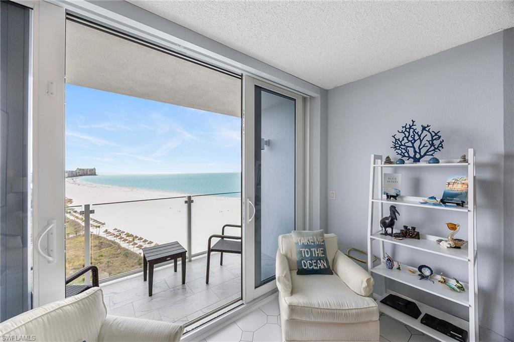 58 North Collier Boulevard, Unit 2101 Marco Island, FL 34145 - Photo 9 of 30 a living room with furniture
