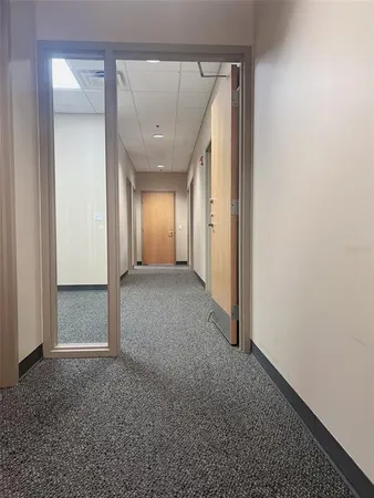 a workspace with furniture and wooden floor