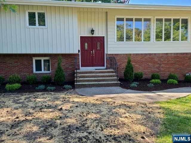 32 Rock Road Englewood Cliffs, NJ 07632 - Photo 30 of 30 a front view of a house with a yard