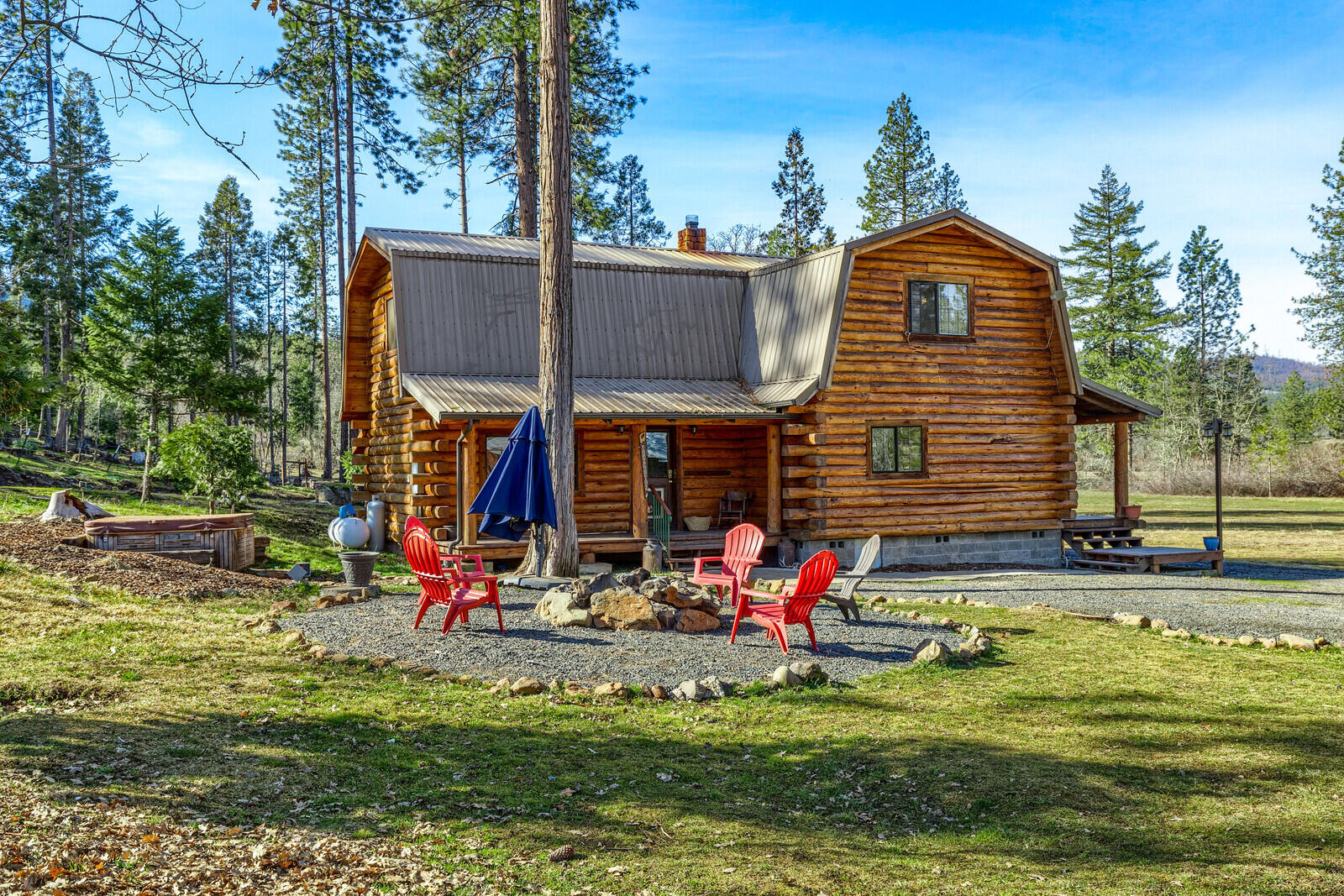 1501 North Obenchain Road Eagle Point, OR 97524 - Photo 10 of 68 a backyard of a house with swimming pool and outdoor seating