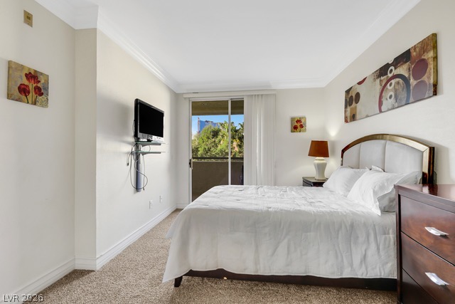 230 East Flamingo Road, Unit 435 Las Vegas, NV 89169 - Photo 9 of 15 Relax in this comfortable primary bedroom, featuring a private balcony access for outdoor enjoyment.