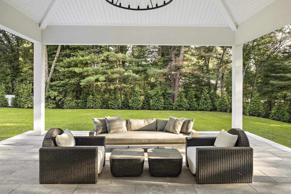 173 Stratford Road Needham, MA 02492 - Photo 5 of 6 a living room with couches floor to ceiling window and yard