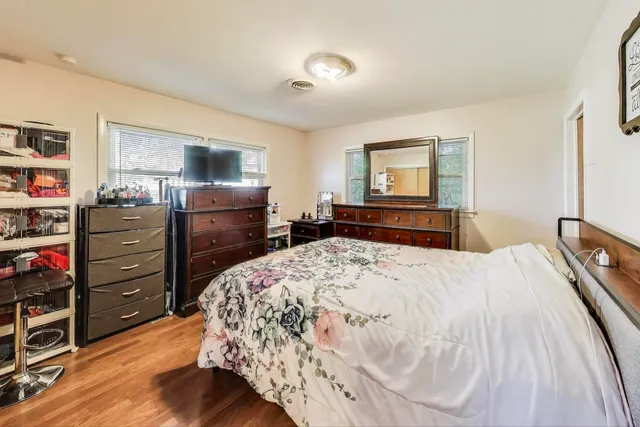 a bedroom with a bed and closet