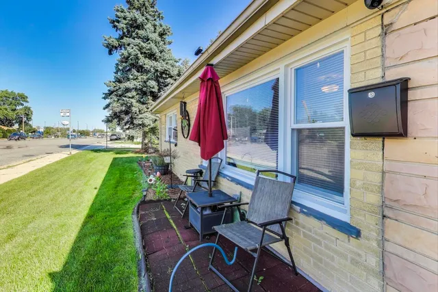 a view of a chairs and table in the patio