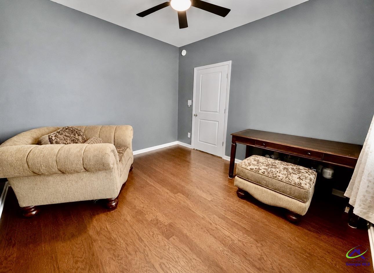 600 Post Oak Way Warner Robins, GA 31088 - Photo 11 of 50 a living room with furniture and a fireplace