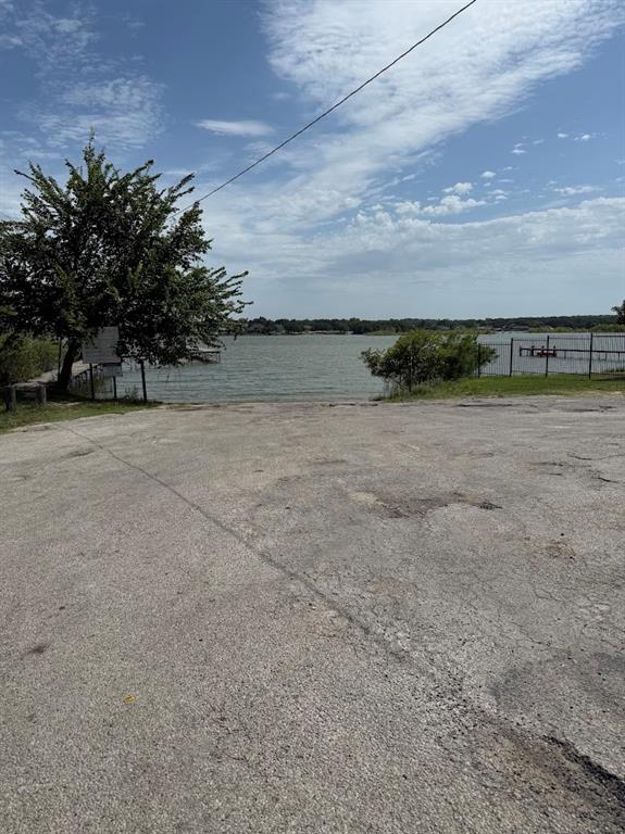11204 Liberty School Road Pelican Bay, TX 76020 - Photo 20 of 23 a view of a dry yard with wooden fence
