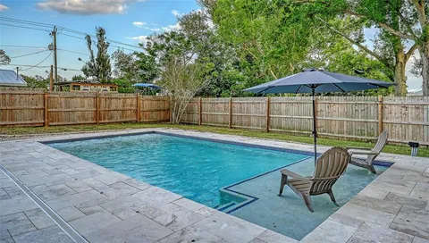 a view of a backyard with a patio
