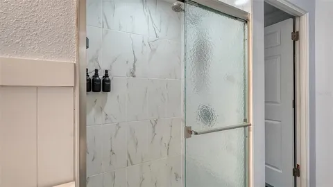 a bathroom with a white shower