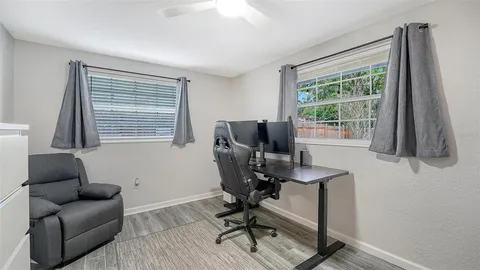 a work room with furniture and a window