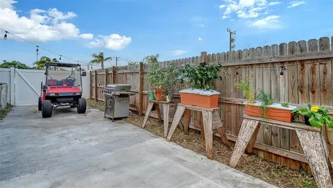 a view of a chairs and table in the patio