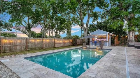 a view of a swimming pool with a patio