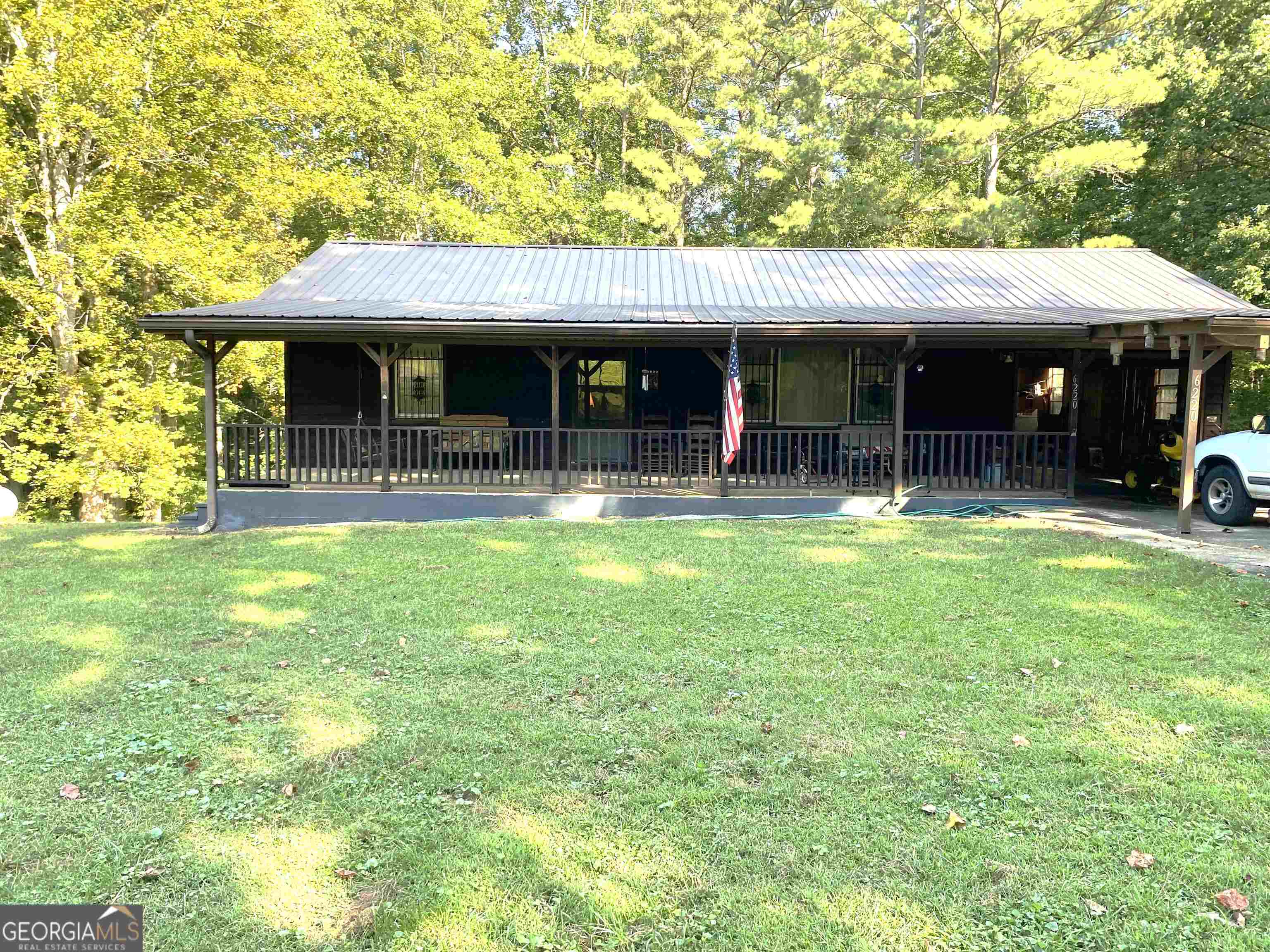 6220 Short Road Fairburn, GA 30213 - Photo 1 of 1 a view of a house with swimming pool and sitting area