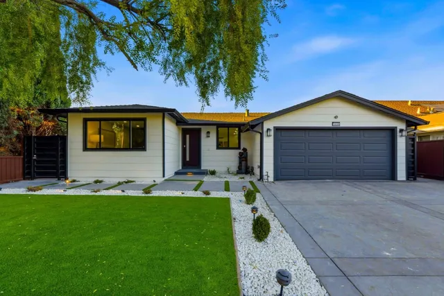 a bathroom with a double vanity sink toilet and shower
