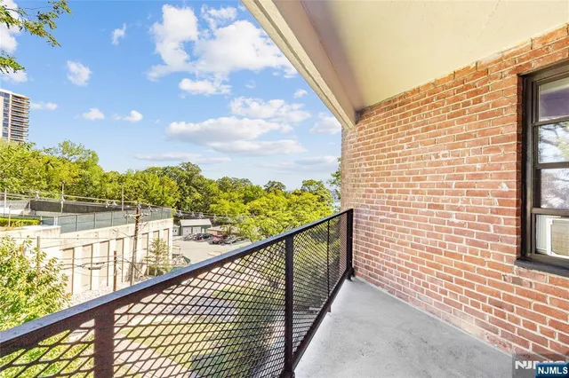 a view of a balcony with an outdoor space