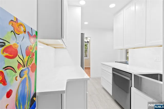 a living room with furniture a dining table and a fireplace