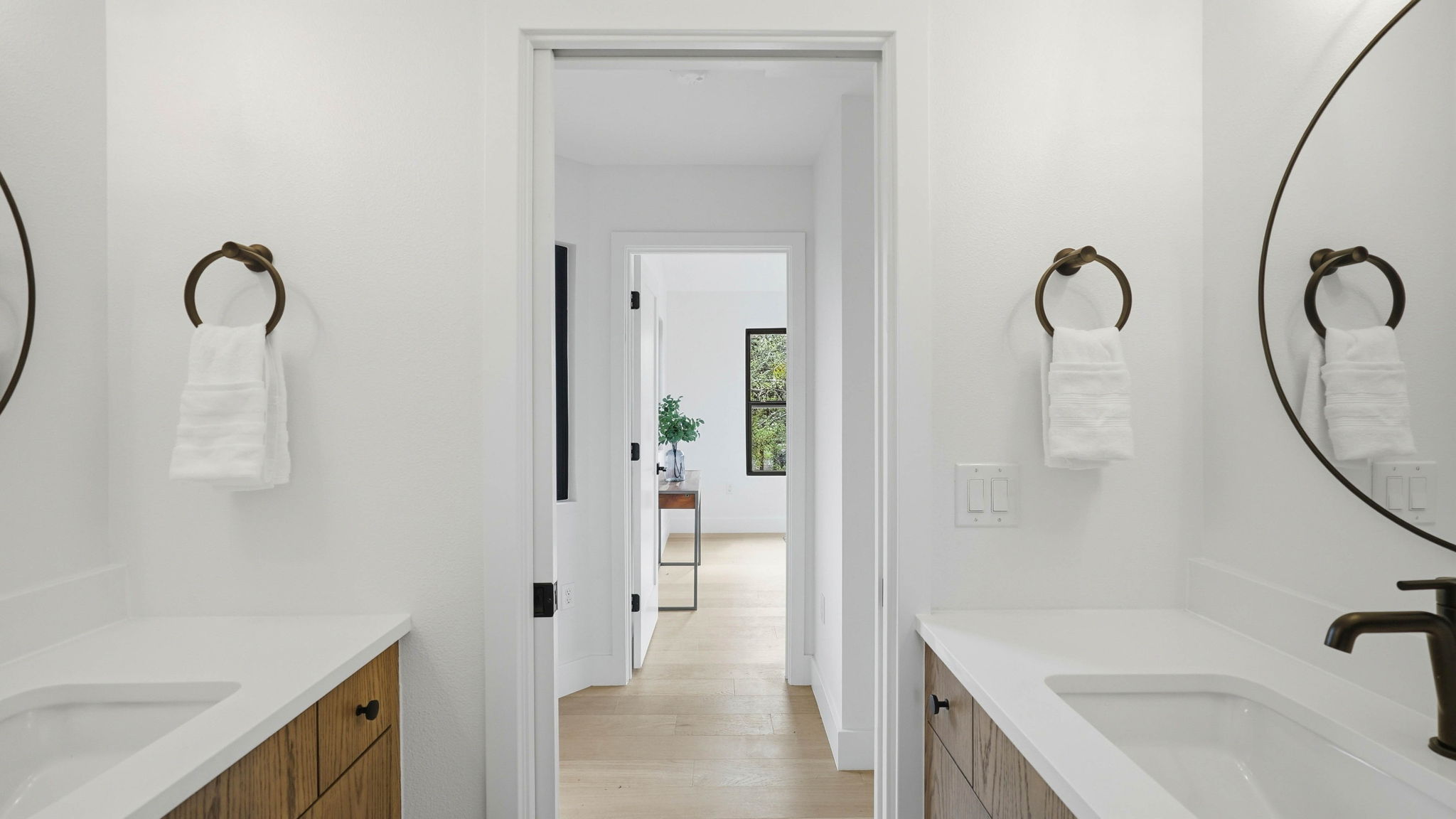 300 Lightsey Road, Unit 2 Austin, TX 78704 - Photo 23 of 28 Bathroom with two vanities and light wood-style floors