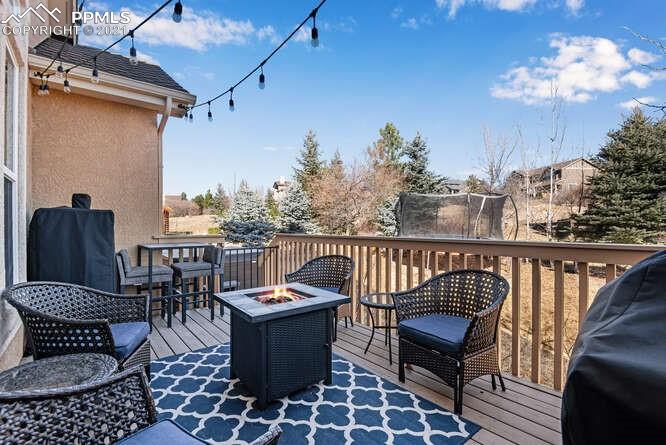 13873 Windy Oaks Road Colorado Springs, CO 80921 - Photo 2 of 28 a view of a balcony with furniture