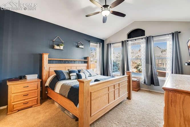 13873 Windy Oaks Road Colorado Springs, CO 80921 - Photo 16 of 28 a bed room with a bed and a window