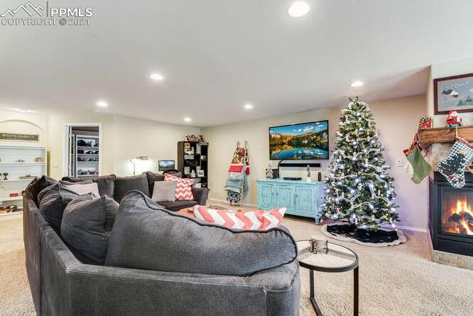 13873 Windy Oaks Road Colorado Springs, CO 80921 - Photo 28 of 28 a living room with furniture and a christmas tree