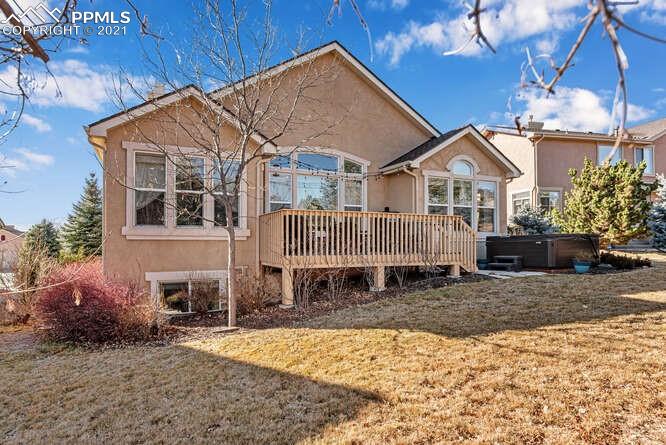 13873 Windy Oaks Road Colorado Springs, CO 80921 - Photo 4 of 28 a view of a house with a yard covered in snow