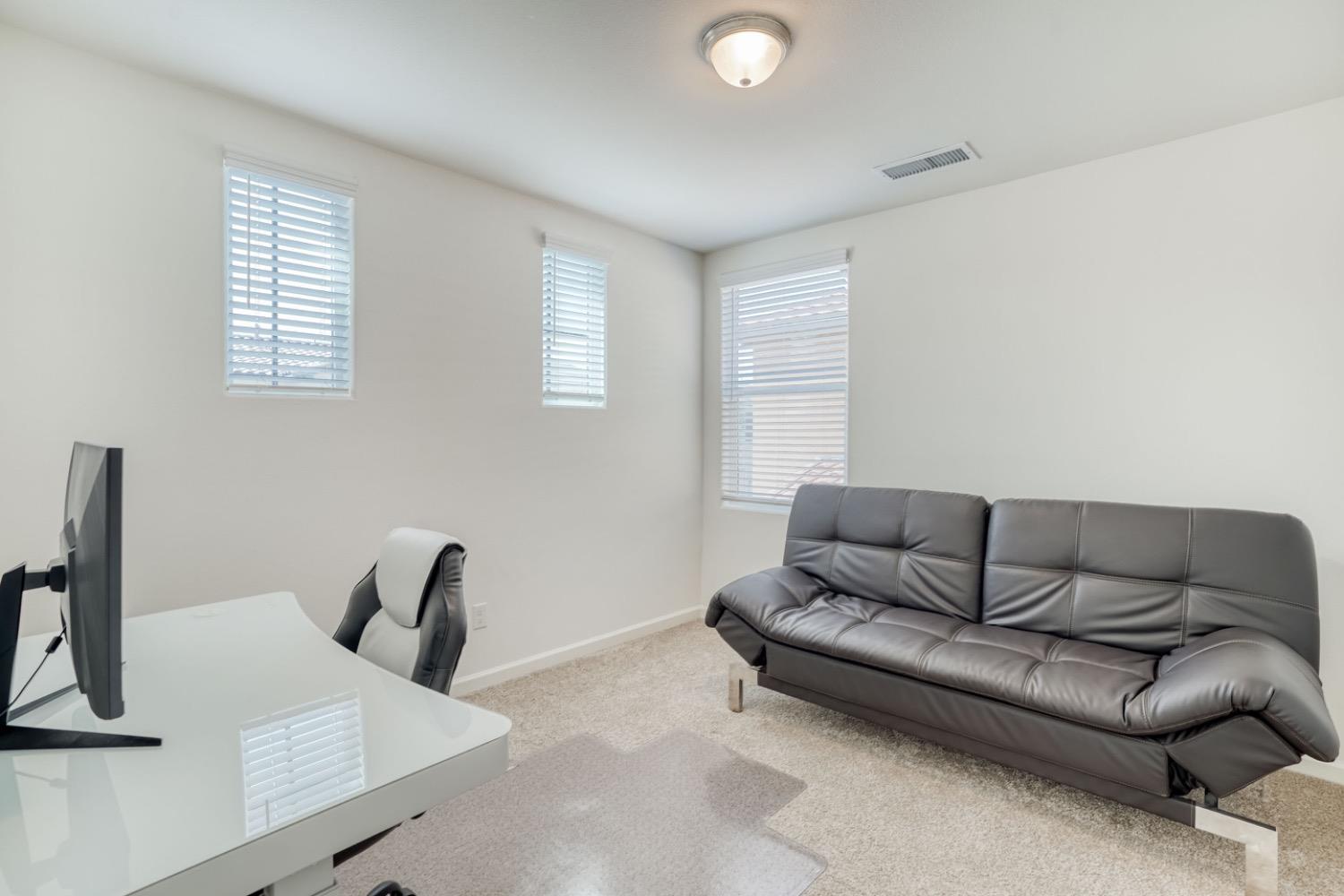 933 Winchell Way West Madera, CA 93636 - Photo 13 of 29 a living room with furniture and a window