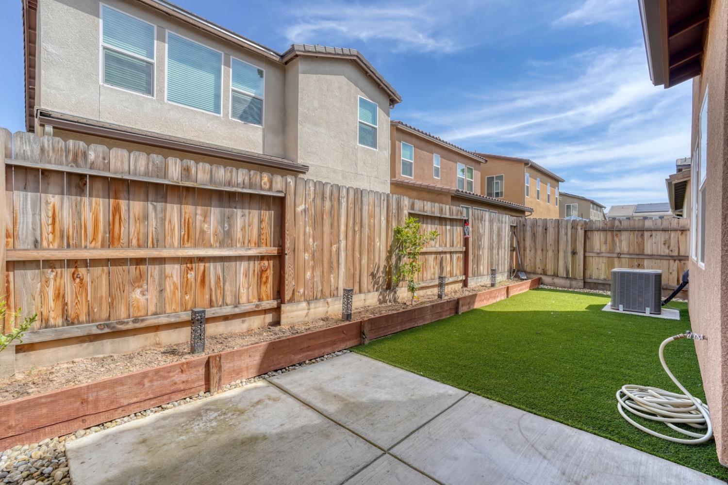 933 Winchell Way West Madera, CA 93636 - Photo 18 of 29 a view of a house with backyard and porch
