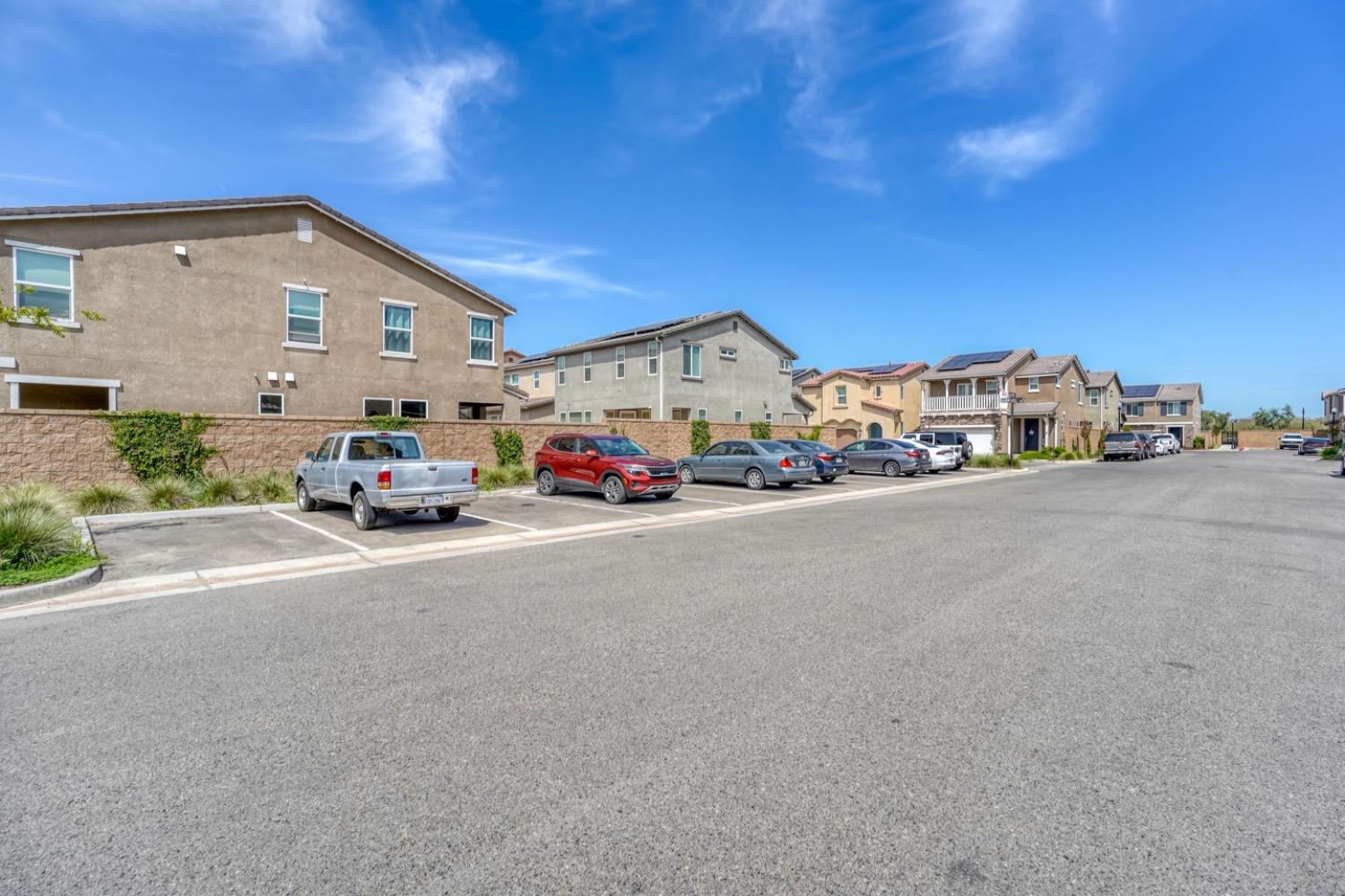 933 Winchell Way West Madera, CA 93636 - Photo 19 of 29 a car parked in front of white house