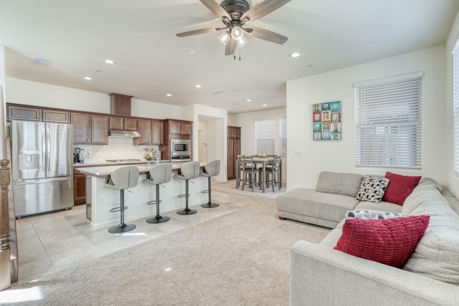 933 Winchell Way West Madera, CA 93636 - Photo 2 of 29 a living room with furniture and kitchen view