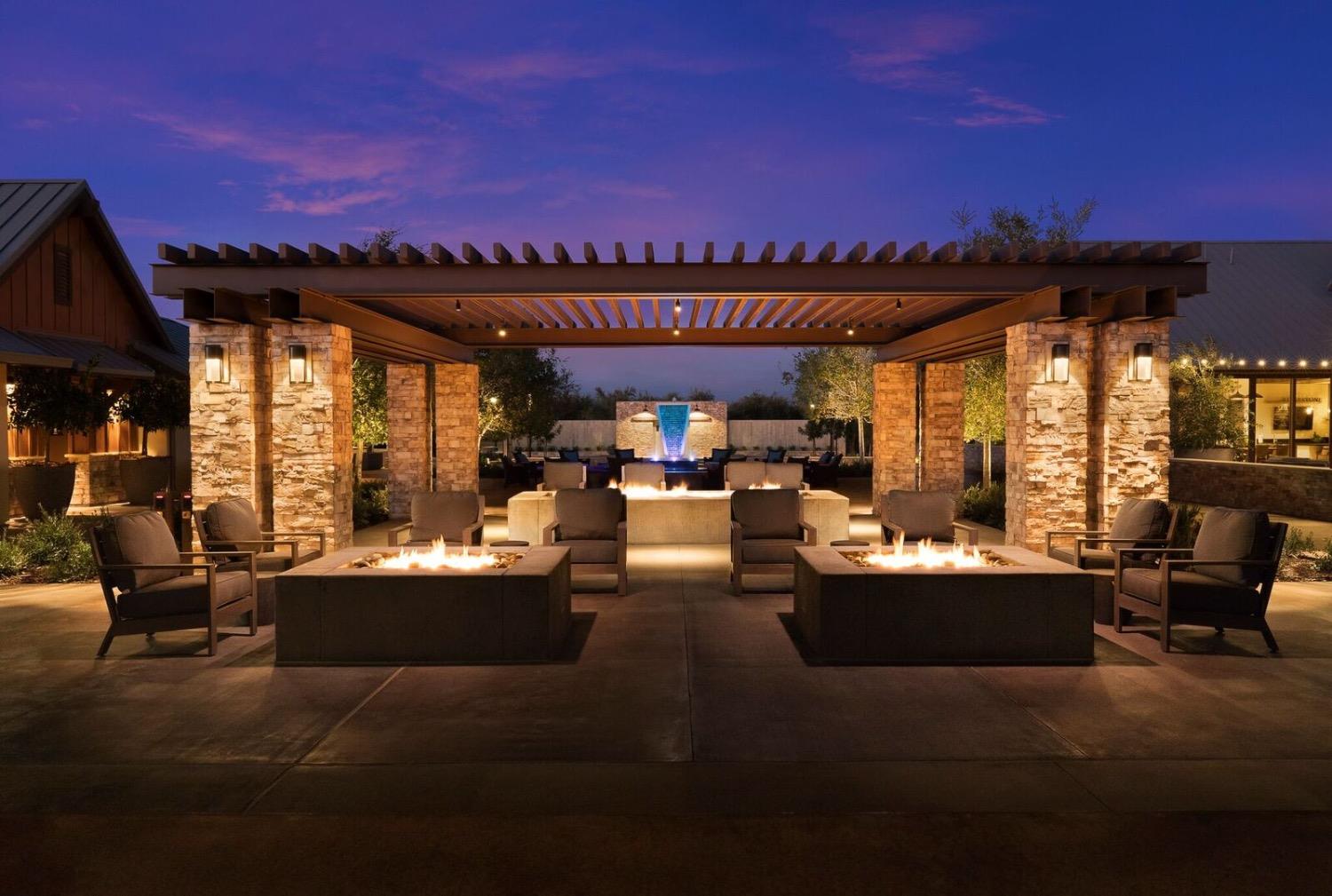 933 Winchell Way West Madera, CA 93636 - Photo 23 of 29 a view of a patio with couches and a table and chairs with wooden floor and city view