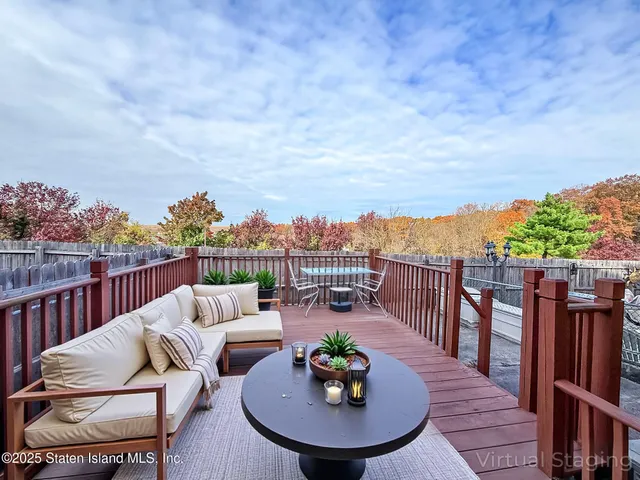 a balcony with furniture and city view