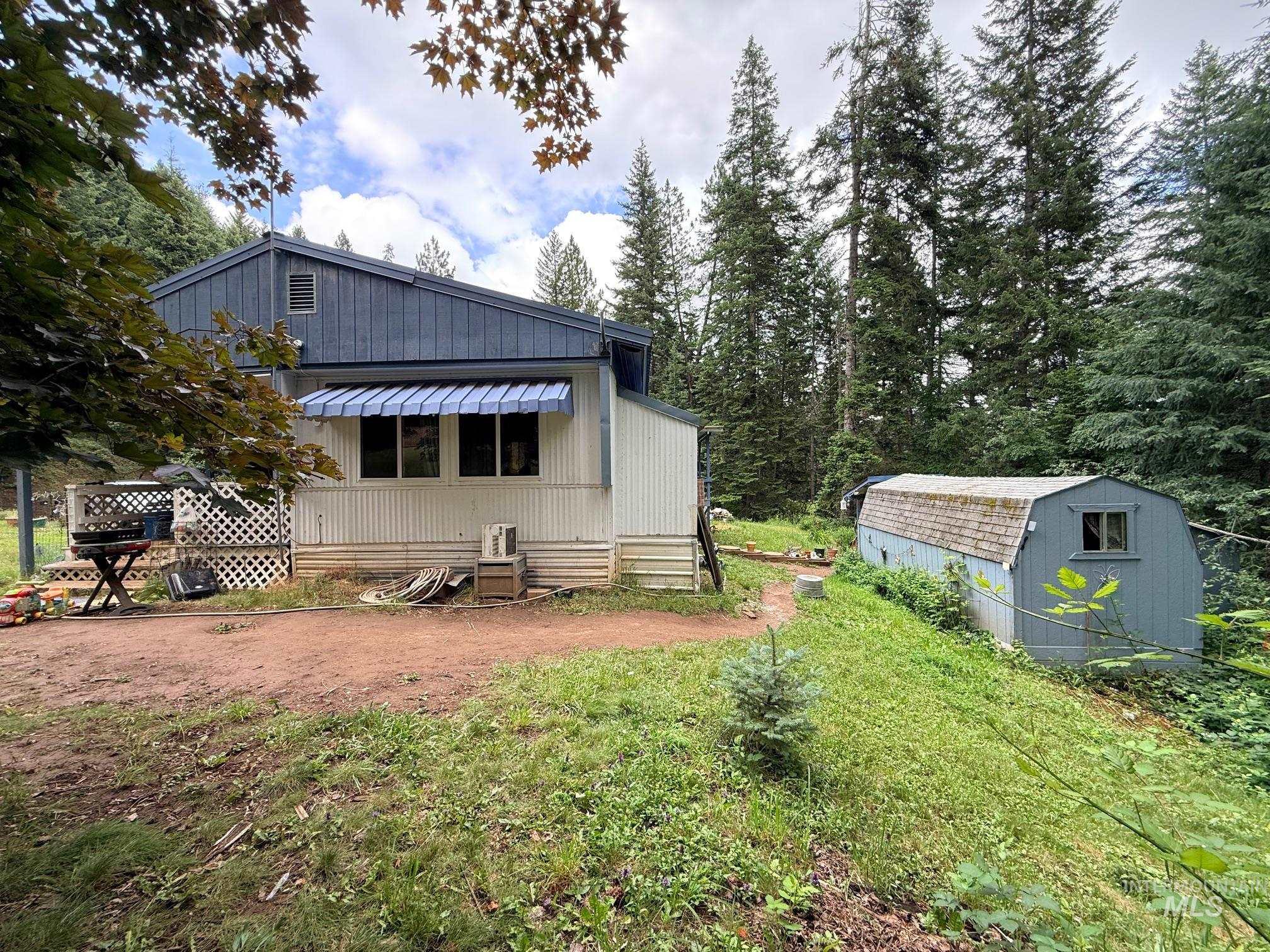5742 Grangemont Road Orofino, ID 83544 - Photo 23 of 25 Ranch-style residence featuring a prominent blue awning and white siding