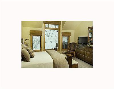 410 Cresta Road Edwards, CO 81632 - Photo 6 of 11 a living room with furniture and a flat screen tv