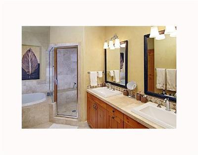 410 Cresta Road Edwards, CO 81632 - Photo 7 of 11 a bathroom with a sink mirror and a shower
