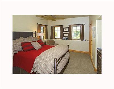 410 Cresta Road Edwards, CO 81632 - Photo 10 of 11 a living room with a bed furniture and a large window
