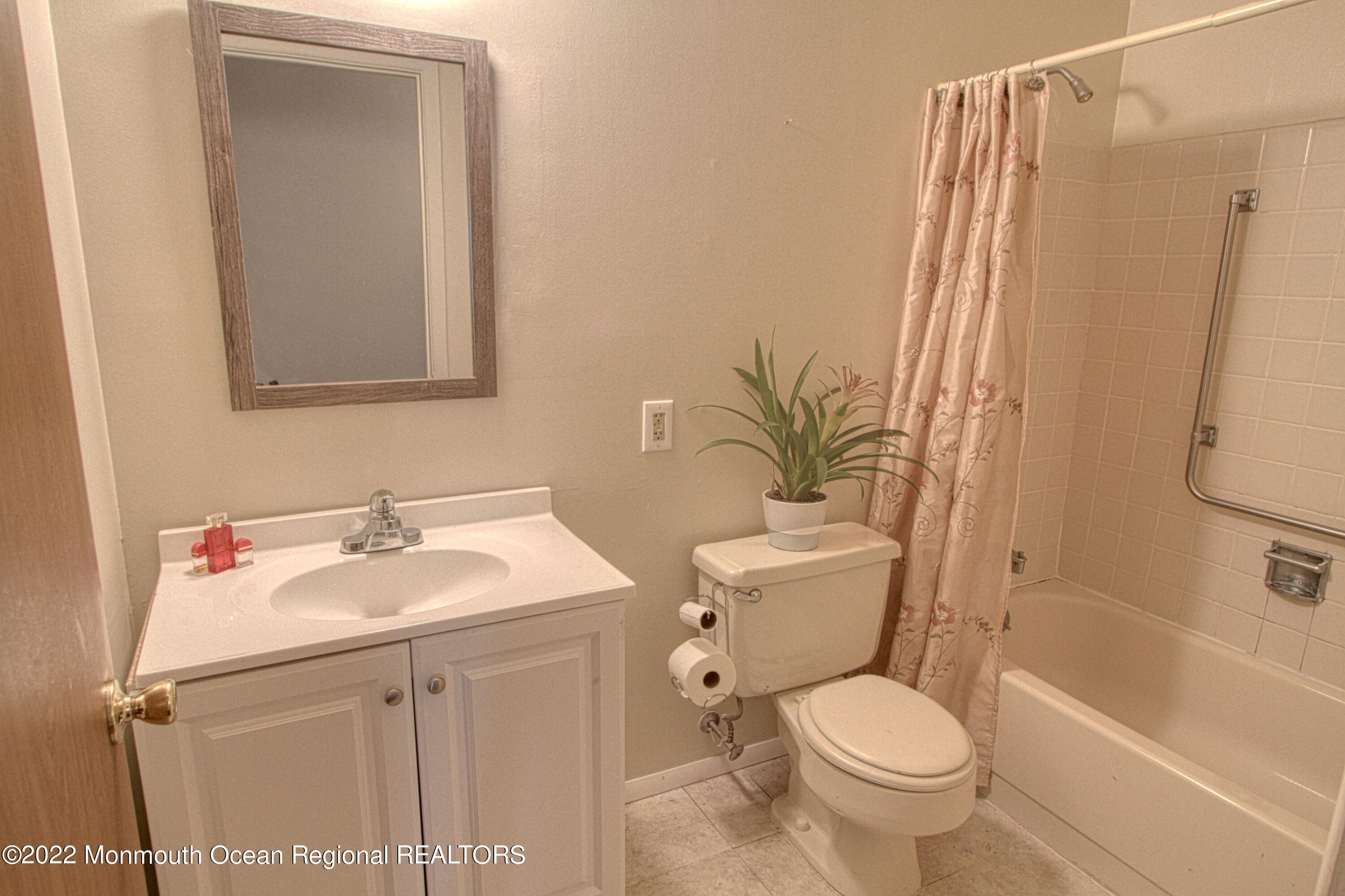 8A Fallbrook Street, Unit A Whiting, NJ 08759 - Photo 11 of 18 a bathroom with a sink toilet and shower