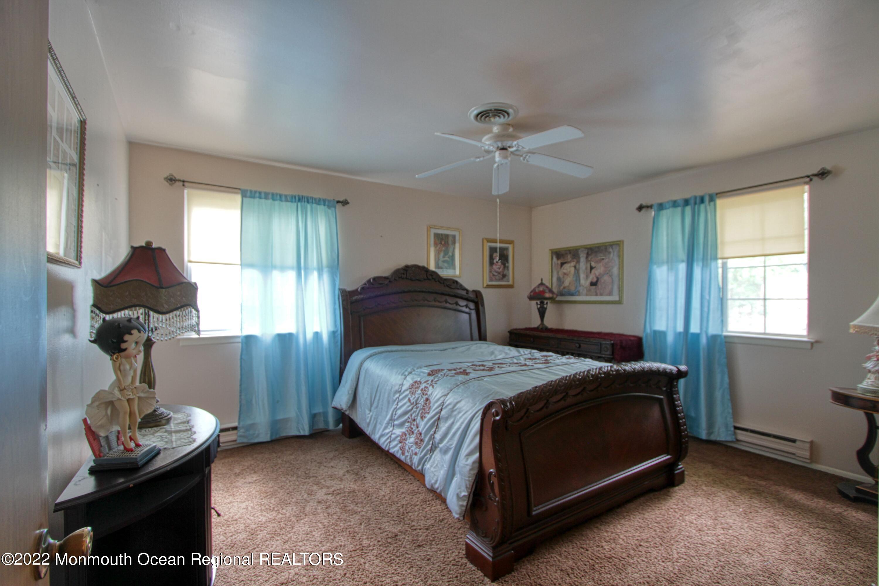 8A Fallbrook Street, Unit A Whiting, NJ 08759 - Photo 12 of 18 a bedroom with a bed and dresser