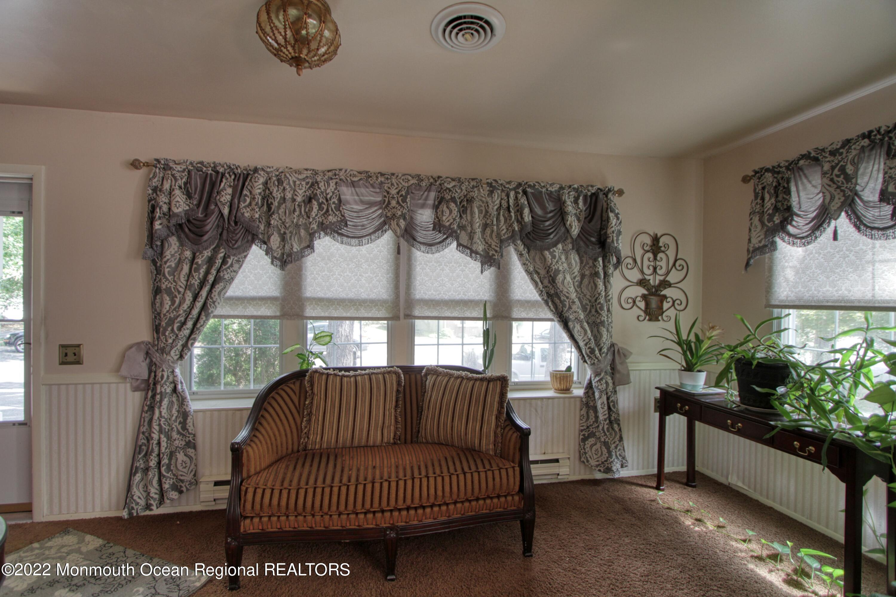 8A Fallbrook Street, Unit A Whiting, NJ 08759 - Photo 13 of 18 a living room with furniture and a large window
