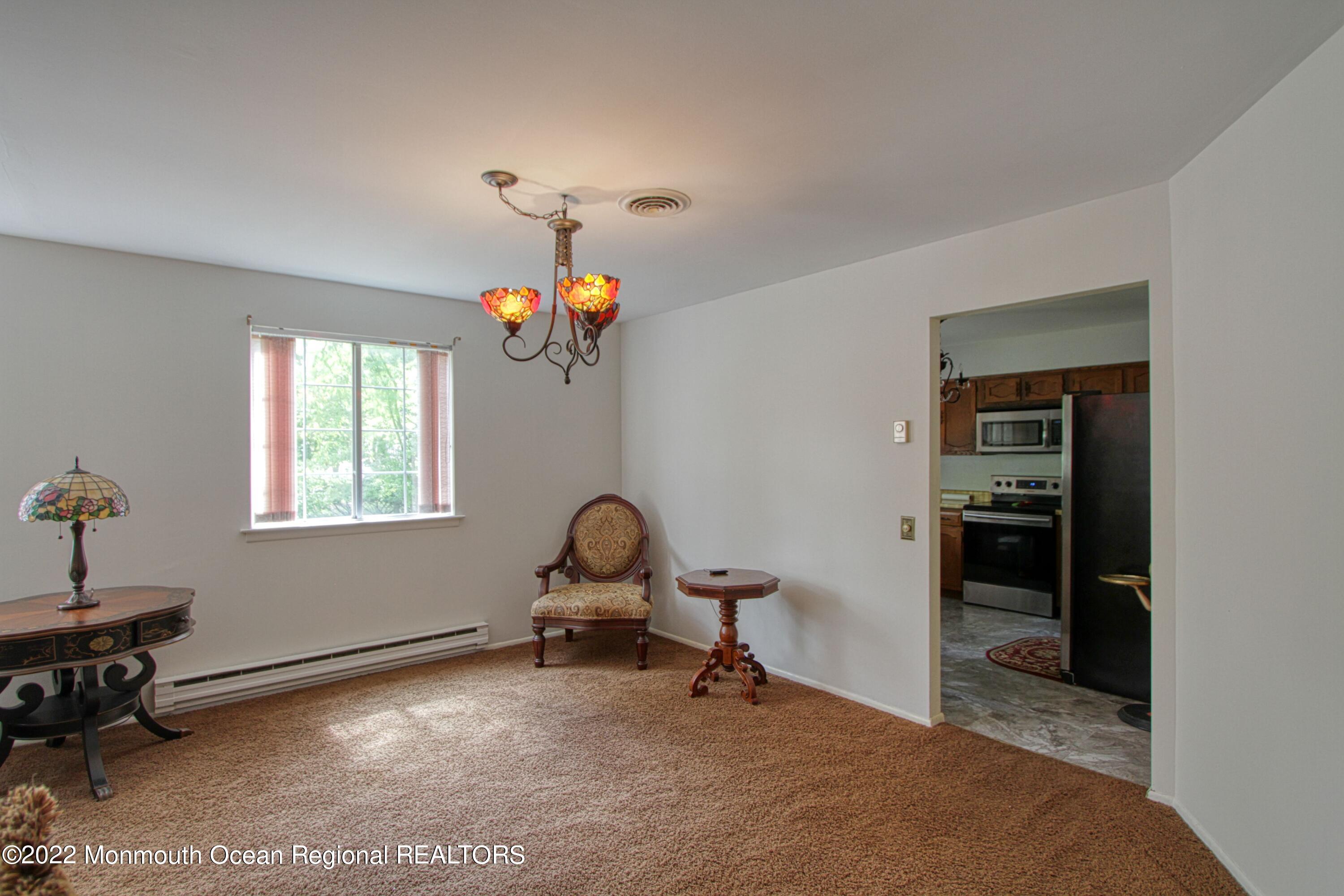 8A Fallbrook Street, Unit A Whiting, NJ 08759 - Photo 4 of 18 a view of a workspace with furniture and a window