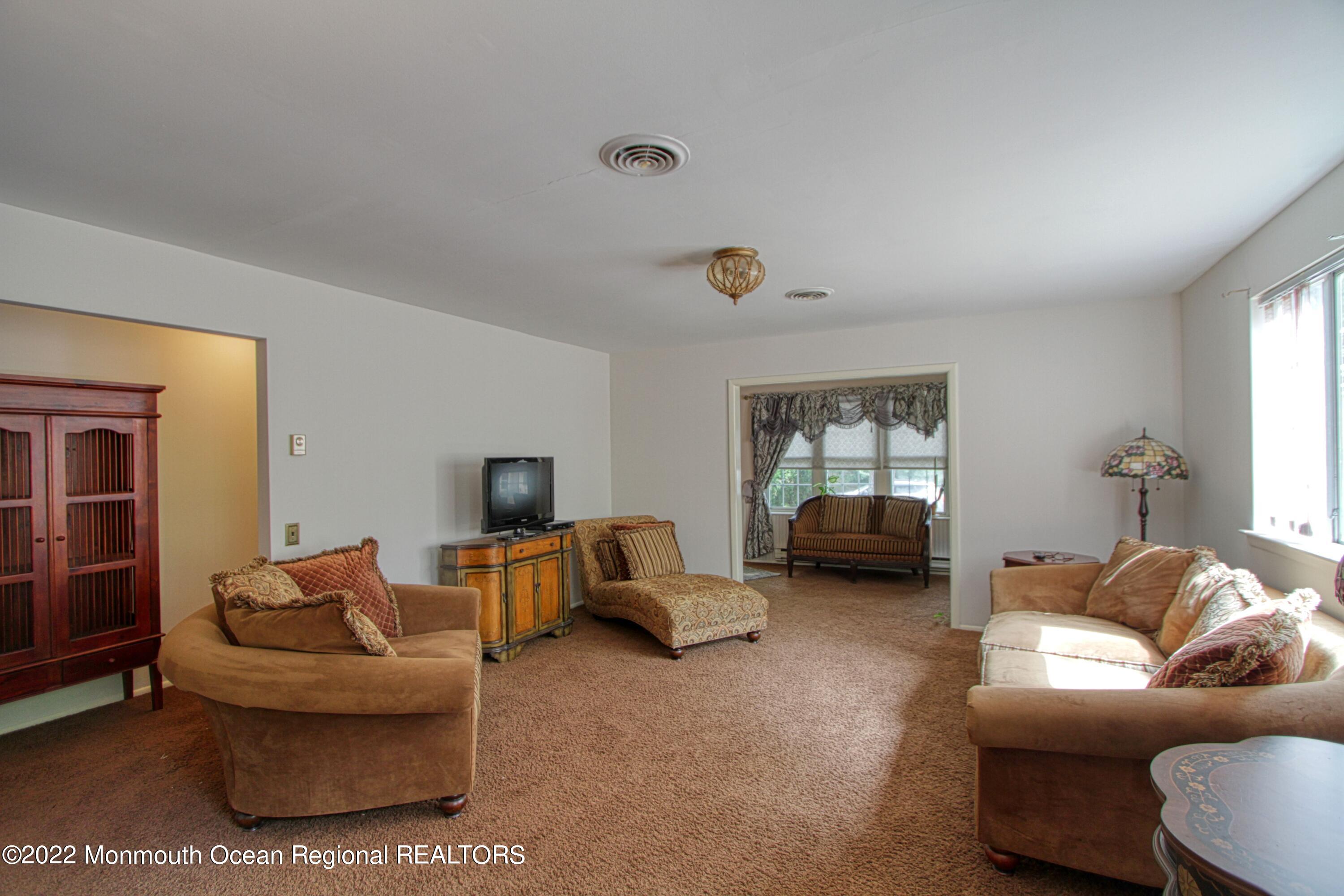 8A Fallbrook Street, Unit A Whiting, NJ 08759 - Photo 5 of 18 a living room with furniture and a window