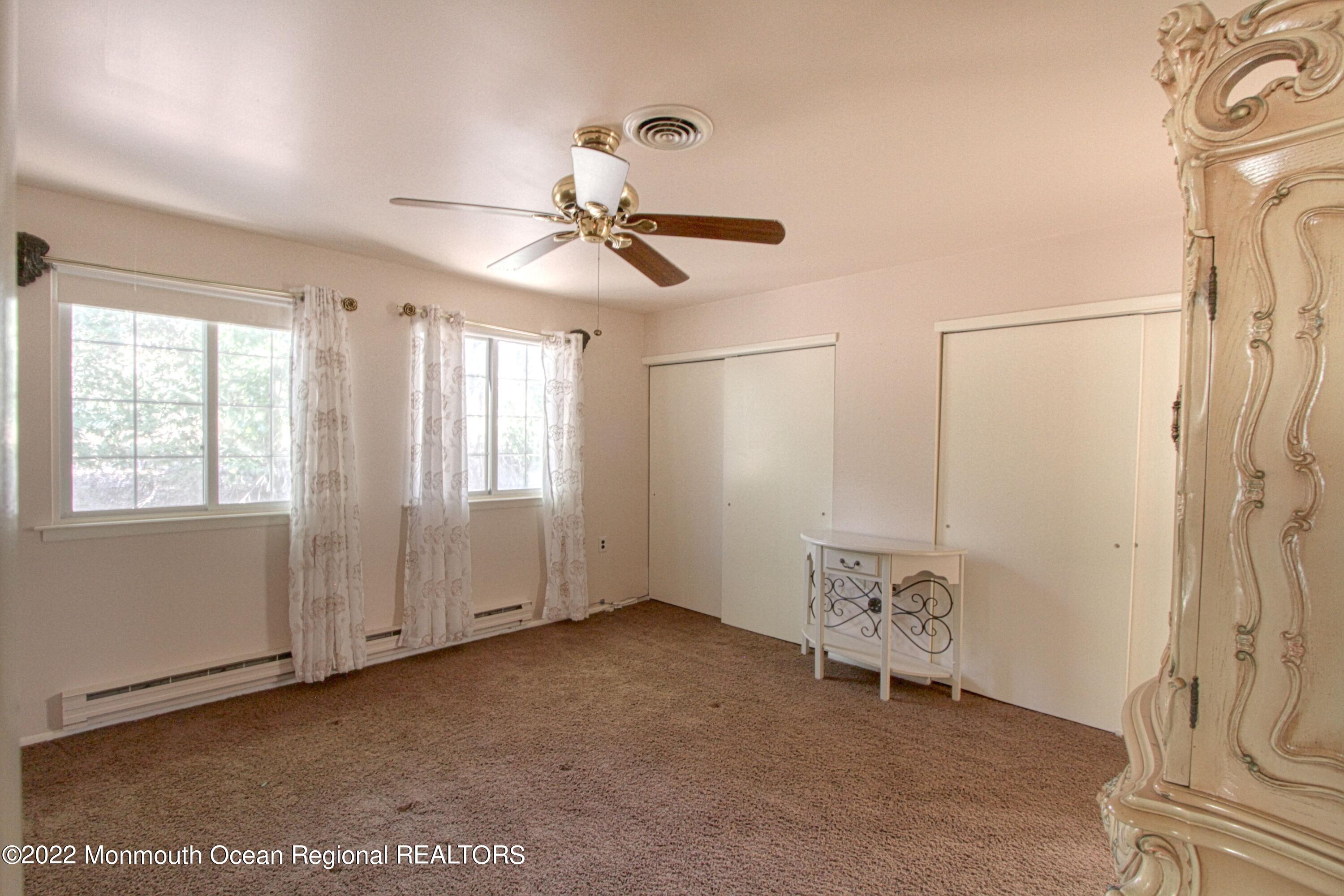 8A Fallbrook Street, Unit A Whiting, NJ 08759 - Photo 8 of 18 a view of an empty room with a window