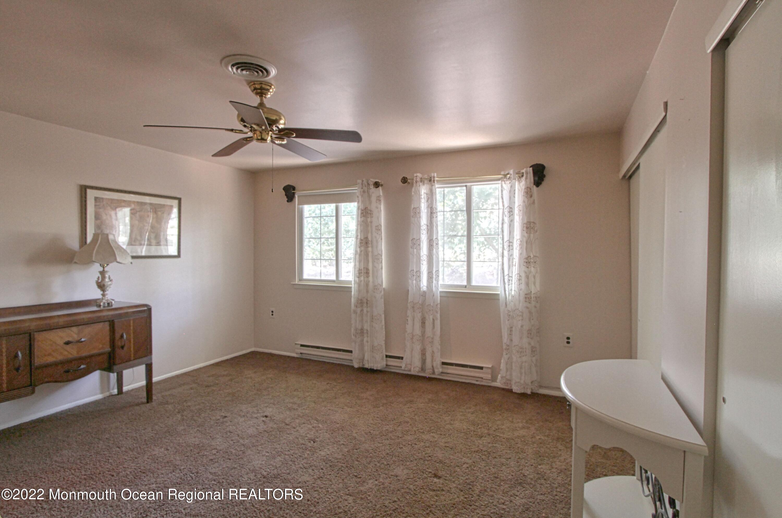 8A Fallbrook Street, Unit A Whiting, NJ 08759 - Photo 10 of 18 a view of an empty room with a window