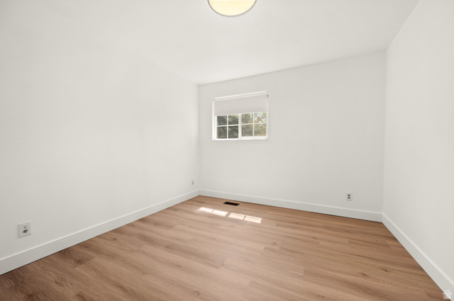 2163 Borg Drive Sandy, UT 84092 - Photo 18 of 31 Unfurnished room featuring light wood-style floors