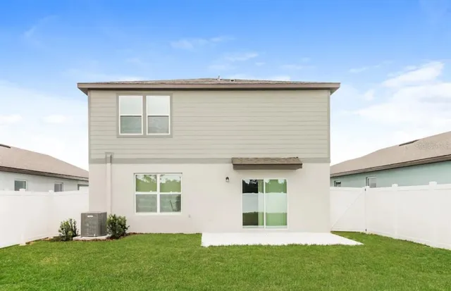 a view of an house with backyard space and garden