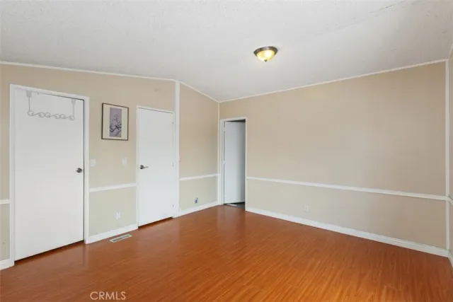 a bathroom with a sink toilet vanity and shower