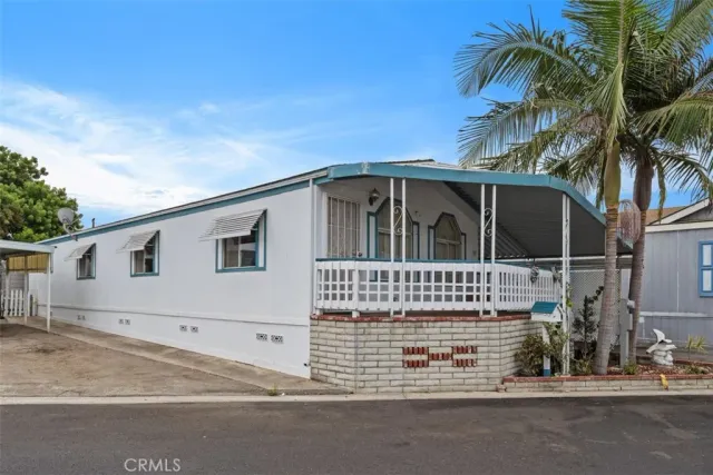 a view of a house with a parking space