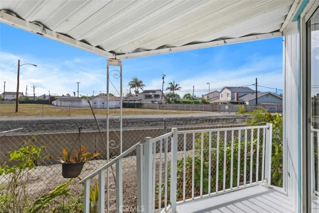 a view of a garden with wooden fence